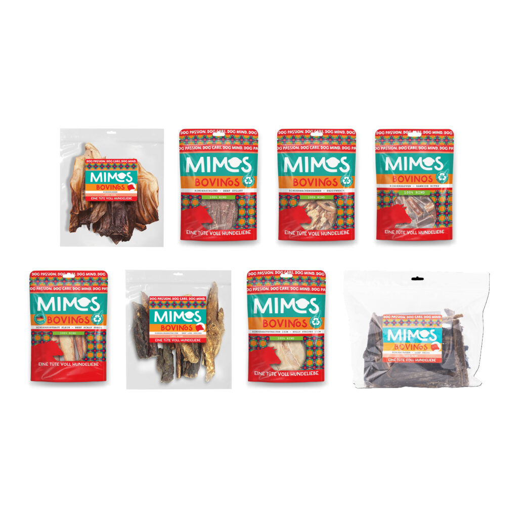 8 pakker hundesnacks på en hvid baggrund.
